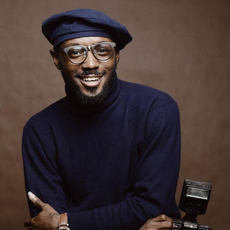 Kaveri Mehta, Lead Design Curator at GladeCrestLinen, reviewing corporate floral arrangements